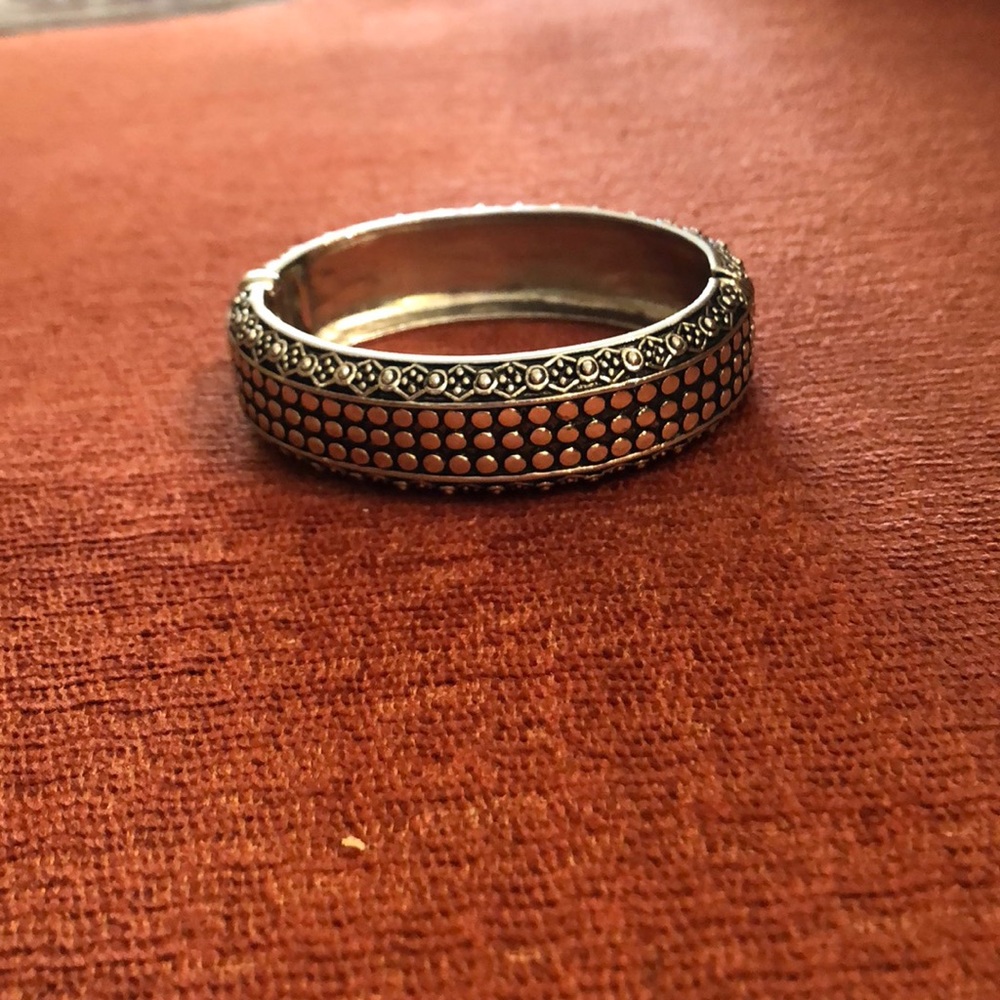 Silver tone bracelet with magnetic lock